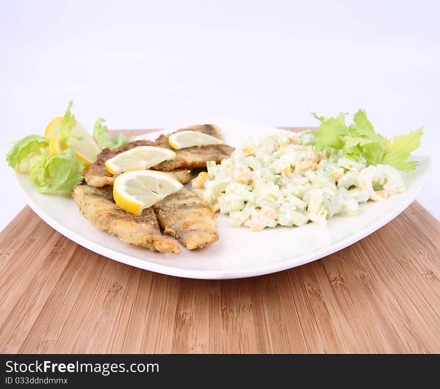 Fried fish with side salad