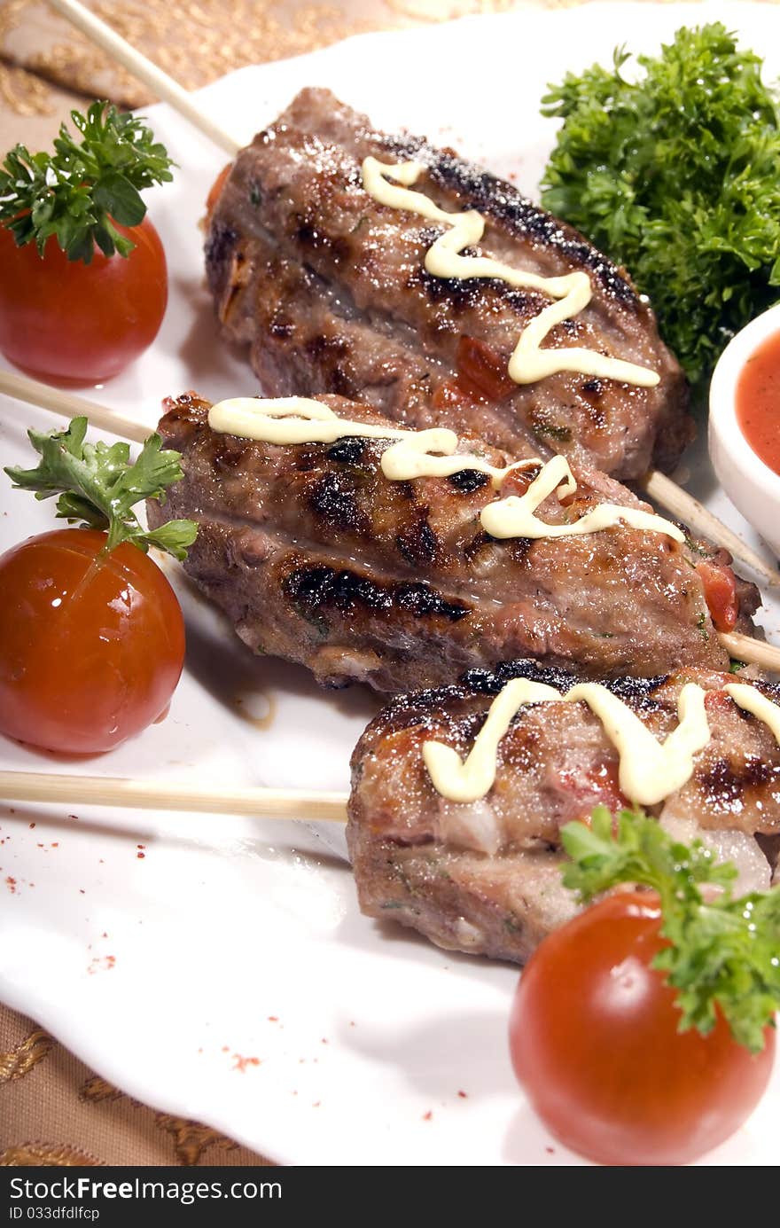 Fried meat served with tomato sauce and salad