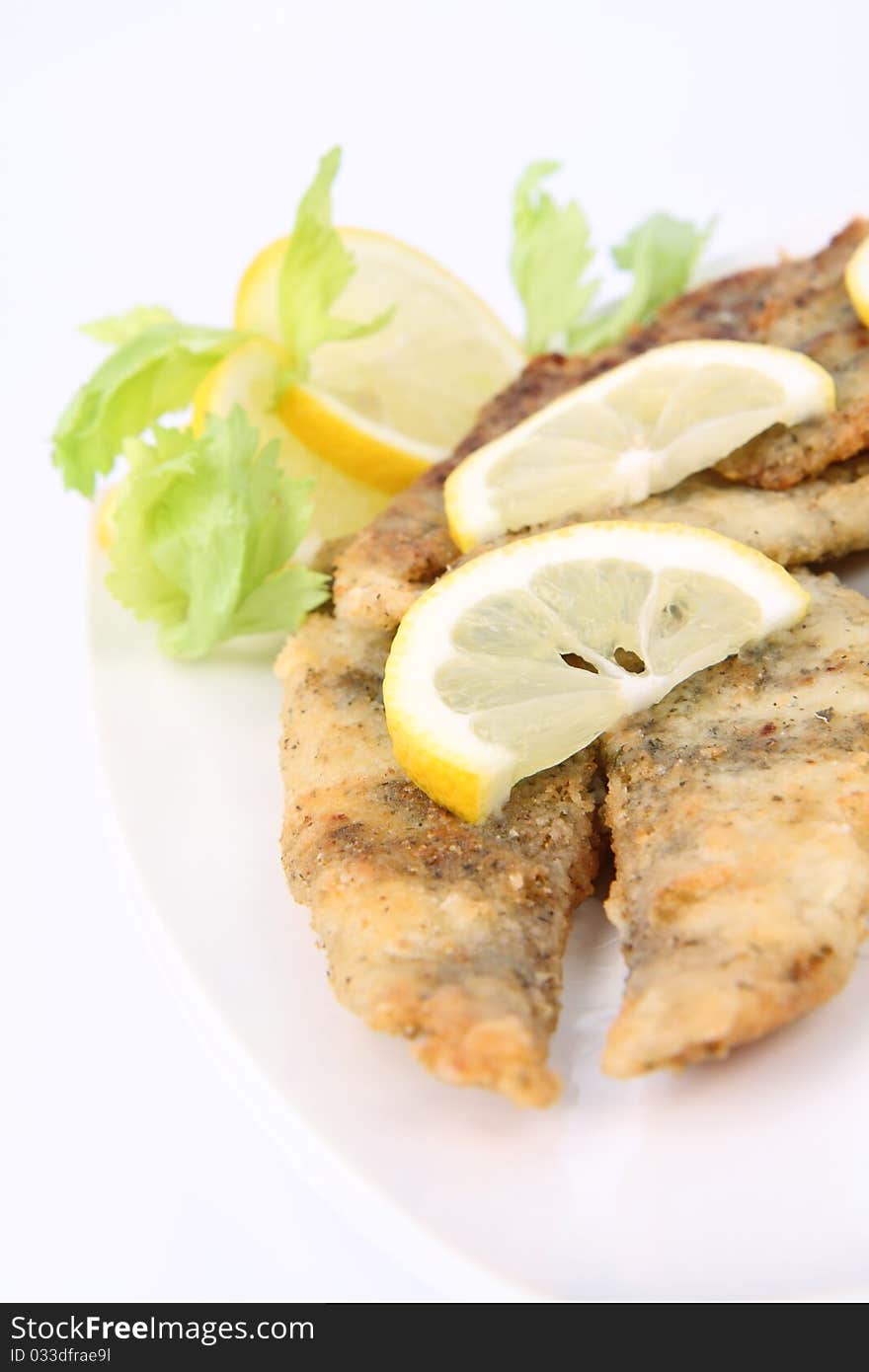 Fried fish decorated with lemon