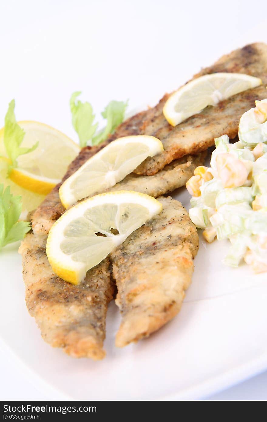 Fried fish with side salad