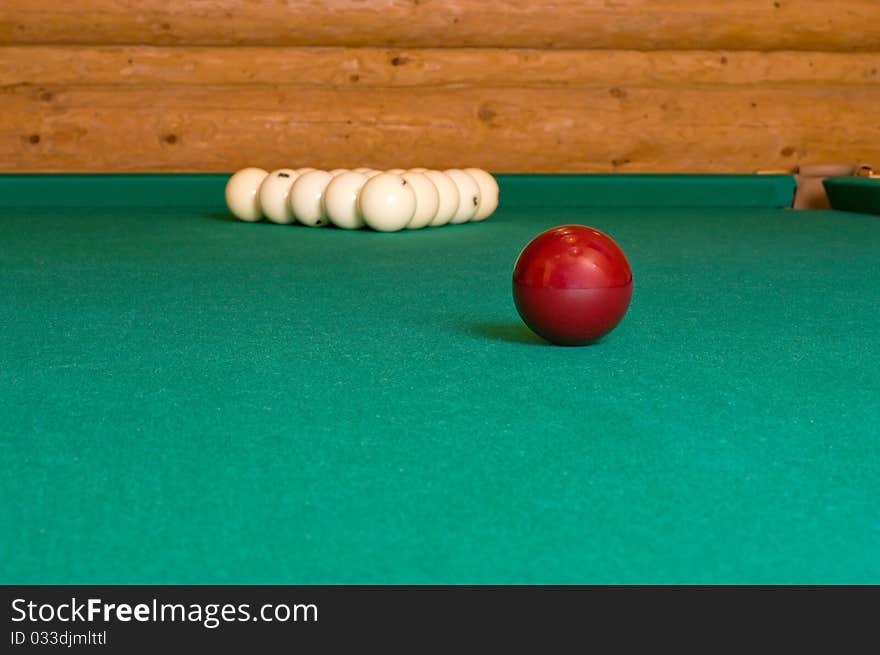 Balls for Russian billiards on a table with green baize. Balls for Russian billiards on a table with green baize.