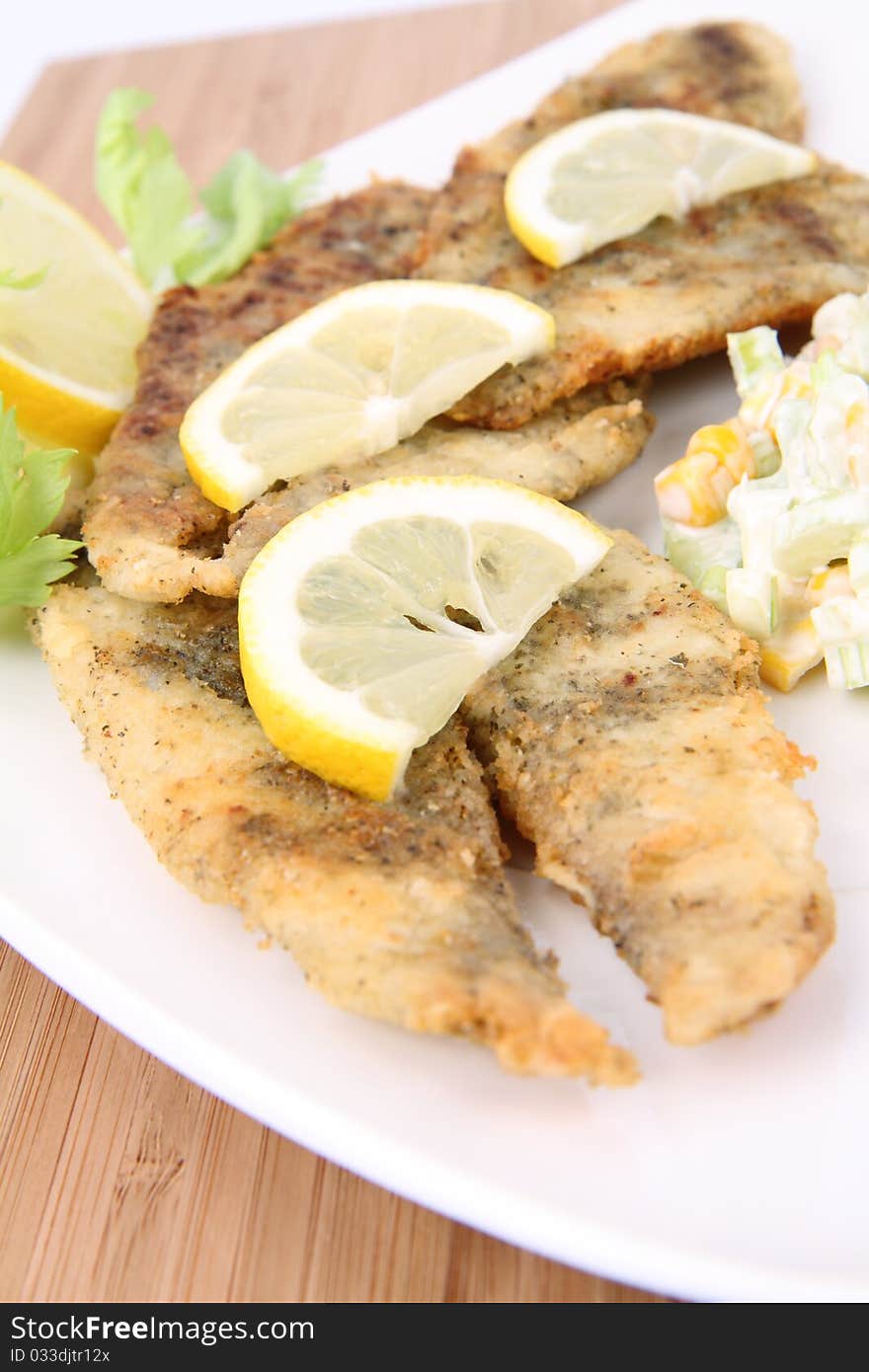 Fried fish with side salad