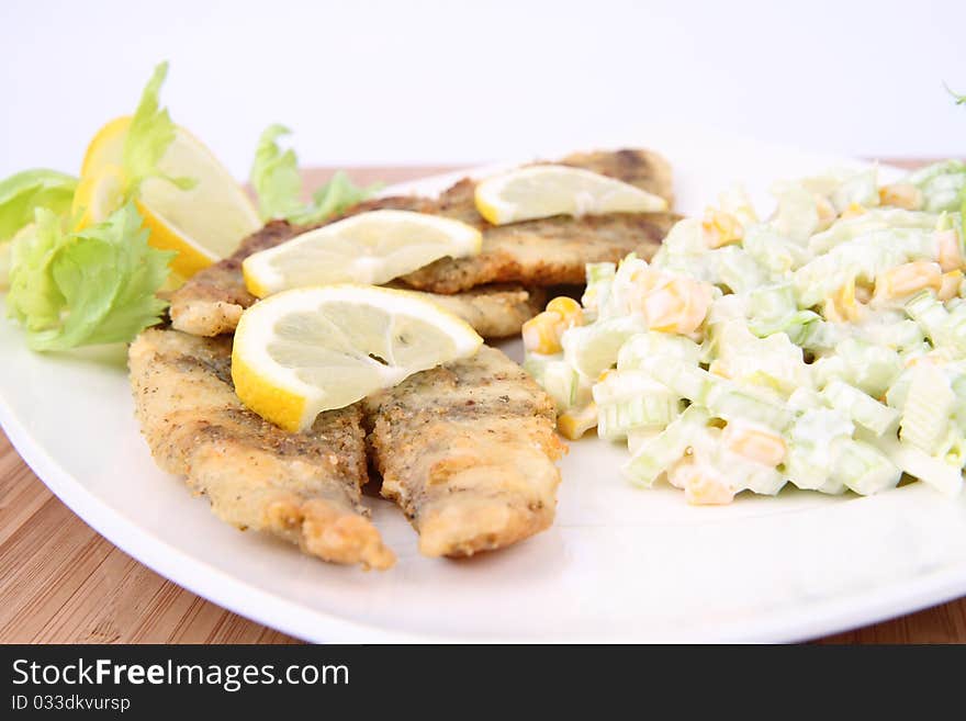 Fried fish with side salad