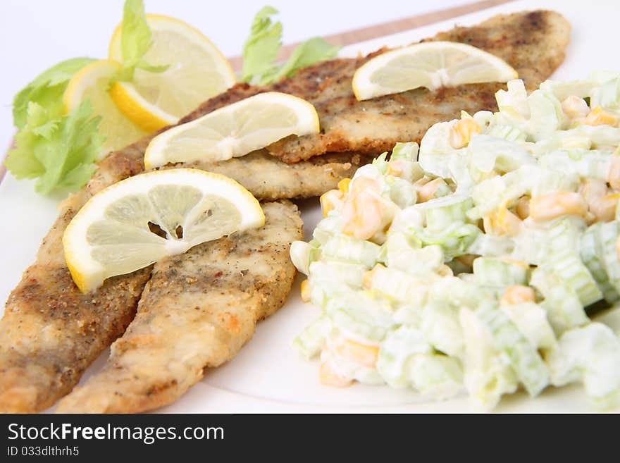 Fried fish with side salad