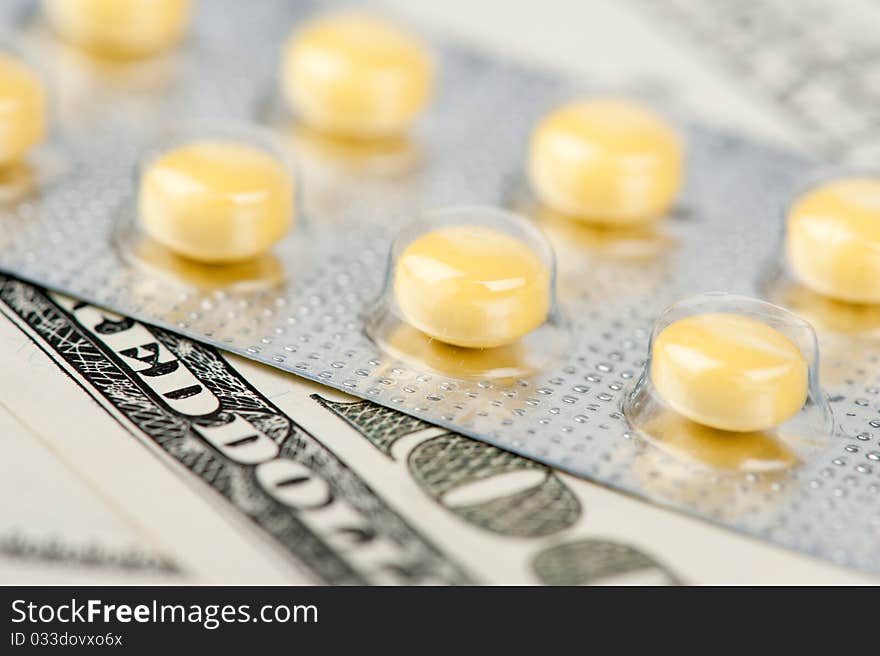 Pills and money, abstract business medical background