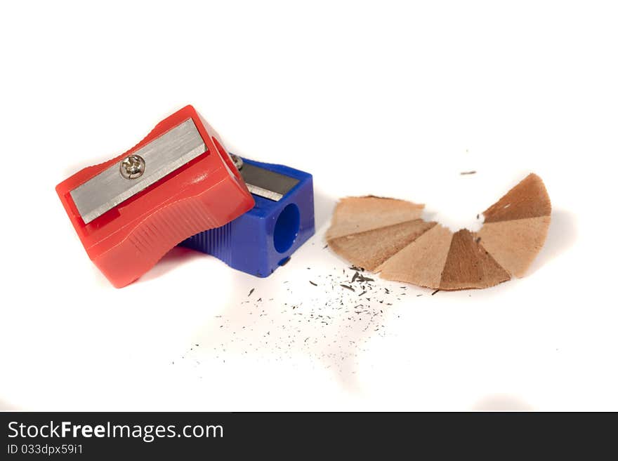 Close view detail of two pencil sharpeners isolated on a white background.