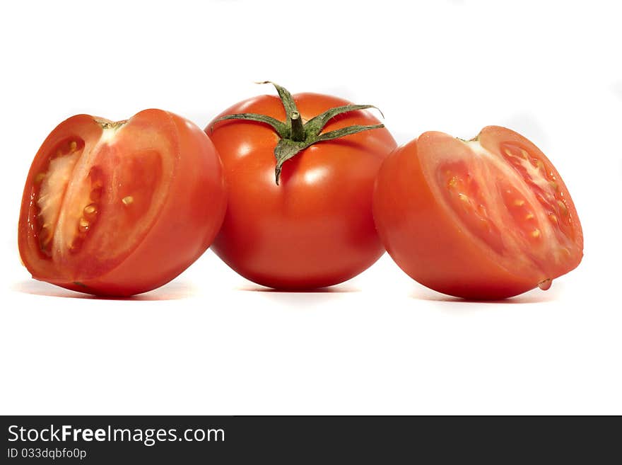 Close view detail of a bunch of  red tomatoes isolated on a white background.