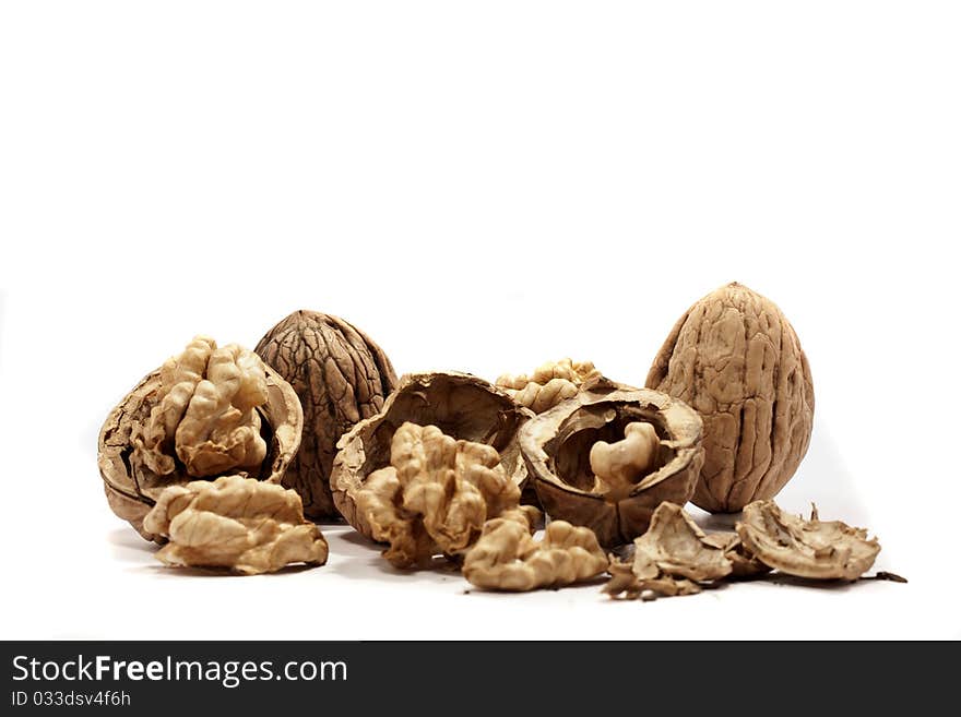 Close view detail of  some walnuts  isolated on a white background. Close view detail of  some walnuts  isolated on a white background.