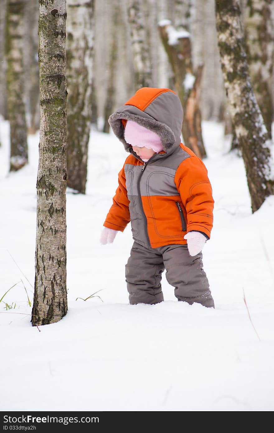 Cute baby walk in winter park