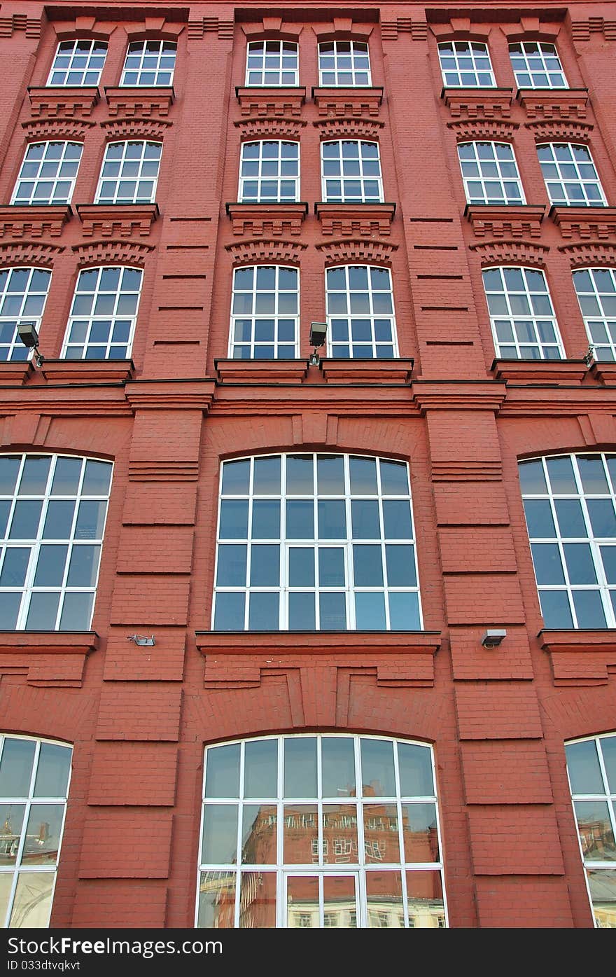 Old brick building with new windows.