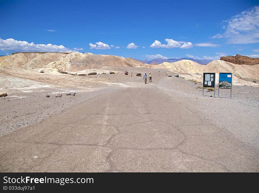 Tourists hiking on Zabriskie Point trail, Death Valley National Park. Tourists hiking on Zabriskie Point trail, Death Valley National Park