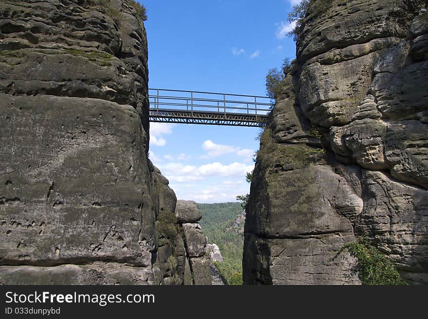 One of the many bridges connecting the rocks of Felsenburg (Rock Castle) Neurathen, a major Saxony tourist attration. One of the many bridges connecting the rocks of Felsenburg (Rock Castle) Neurathen, a major Saxony tourist attration