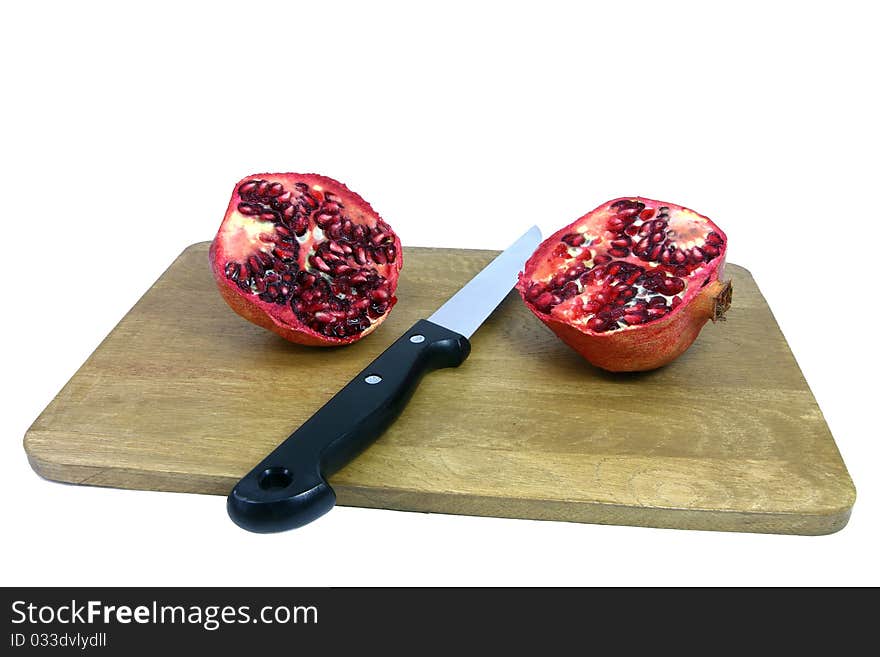 Pomegranate is a delicious kind of apple which is here cut in half