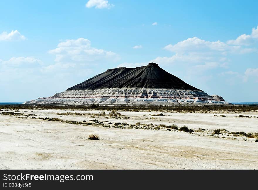 Hill with strata  in Mangistau, Kazakhstan - Ustyurt plateau. Hill with strata  in Mangistau, Kazakhstan - Ustyurt plateau