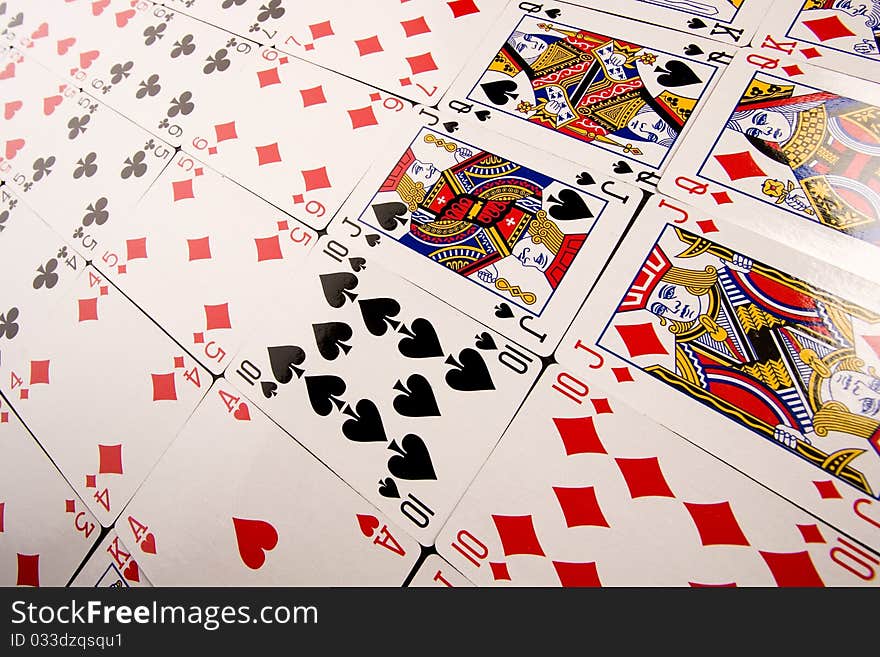 Close-up of Poker cards and gambling chips on green background