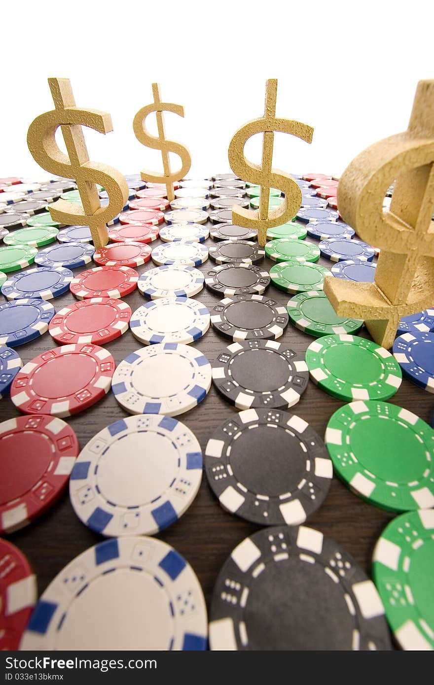 Multi - colored gambling chips on a background. Multi - colored gambling chips on a background