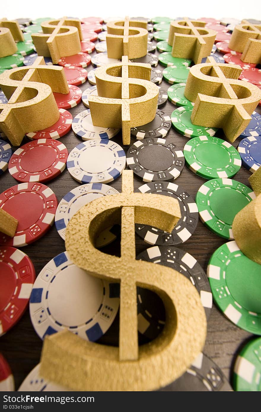 Multi - colored gambling chips and US dollar sign on a background. Multi - colored gambling chips and US dollar sign on a background