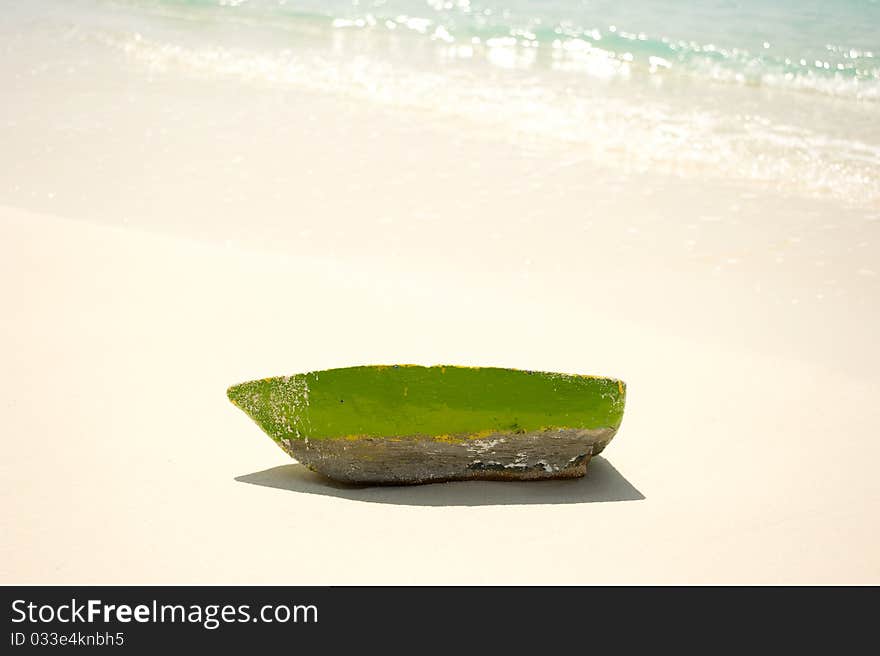 Wooden boat on the sand