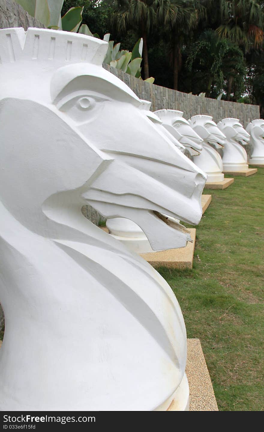 White decorative concrete replica of trojan horses.