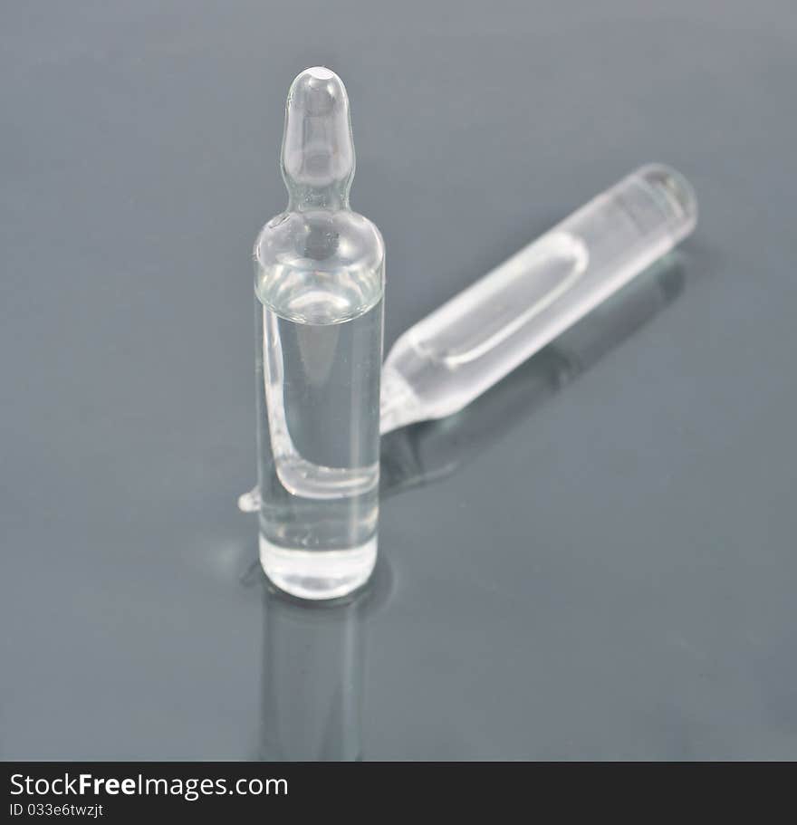 Vial with a gray background