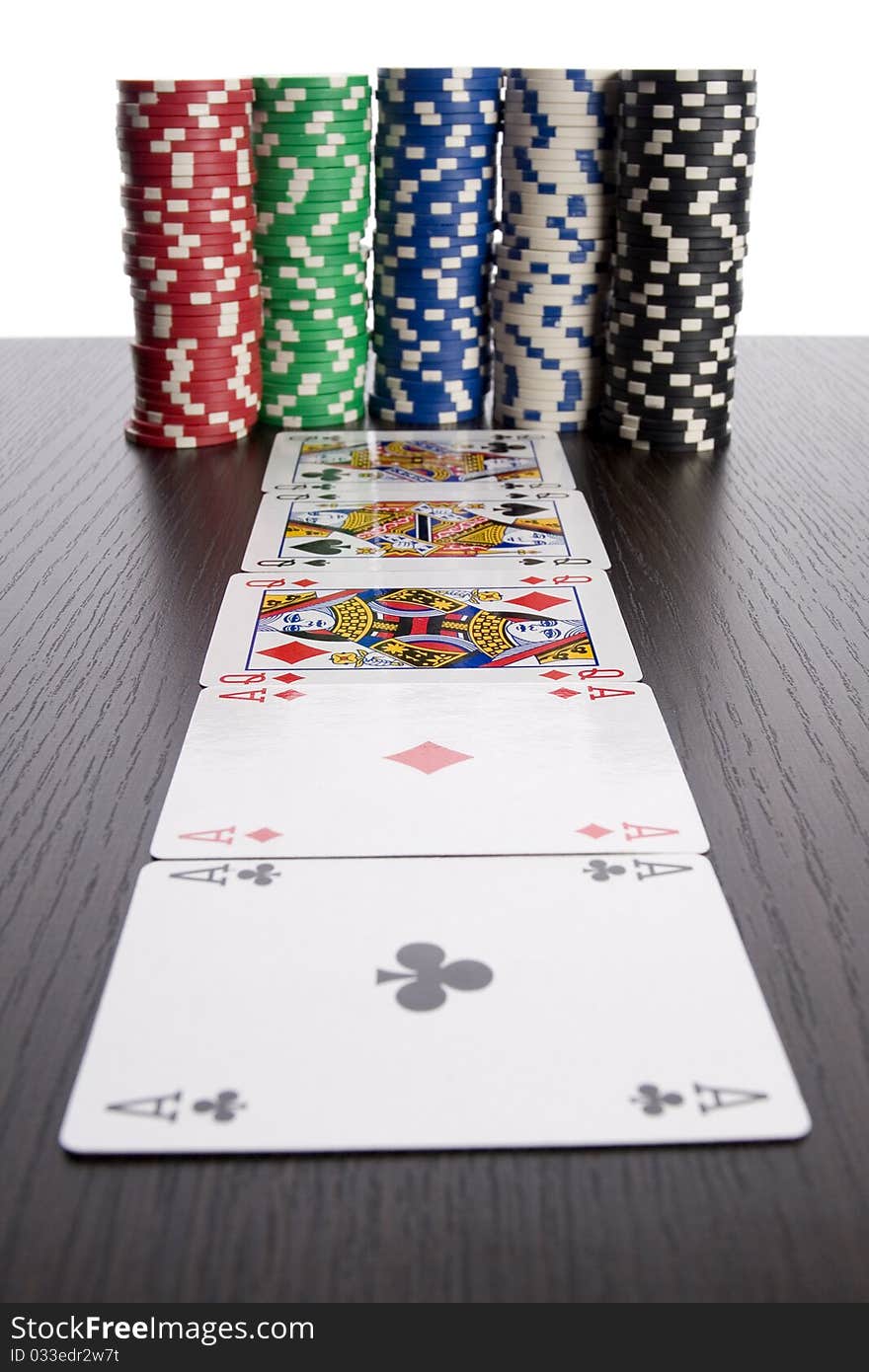 Close-up of Poker cards and gambling chips on green background. Close-up of Poker cards and gambling chips on green background