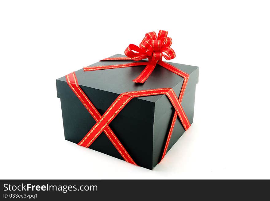 One gift box with a red tape is isolated on a white background