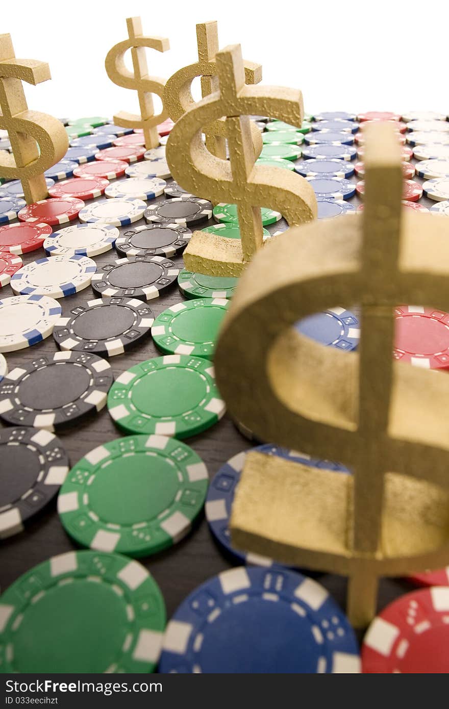 Multi - colored gambling chips and US dollar sign on a background. Multi - colored gambling chips and US dollar sign on a background