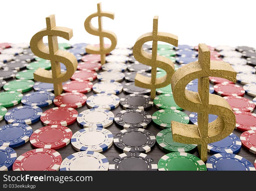 Multi - colored gambling chips and US dollar sign on a background. Multi - colored gambling chips and US dollar sign on a background