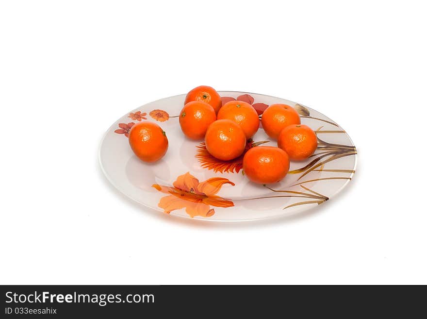 Plate on a white background with mandarins. Plate on a white background with mandarins