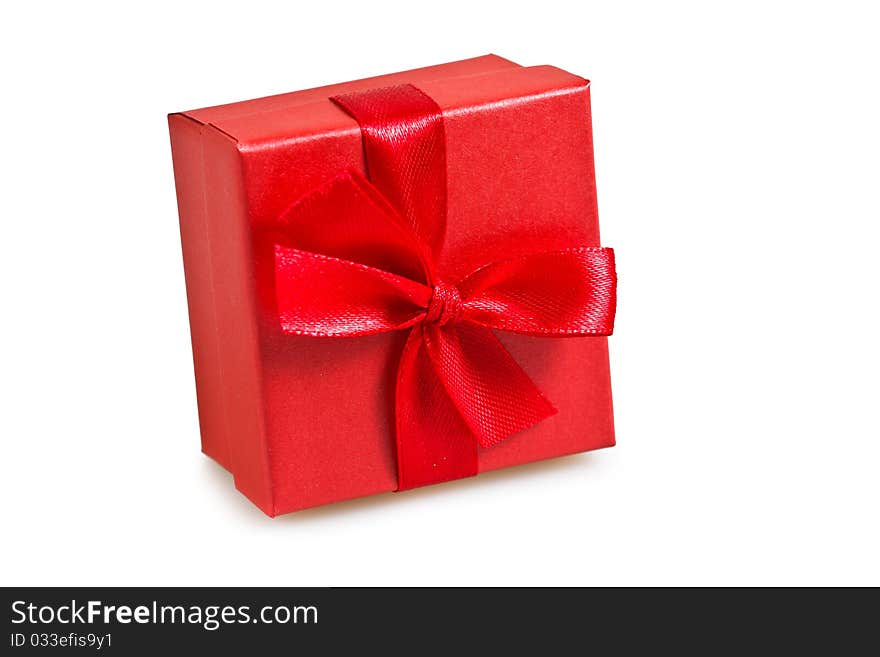 Gift in the red packing on a white background