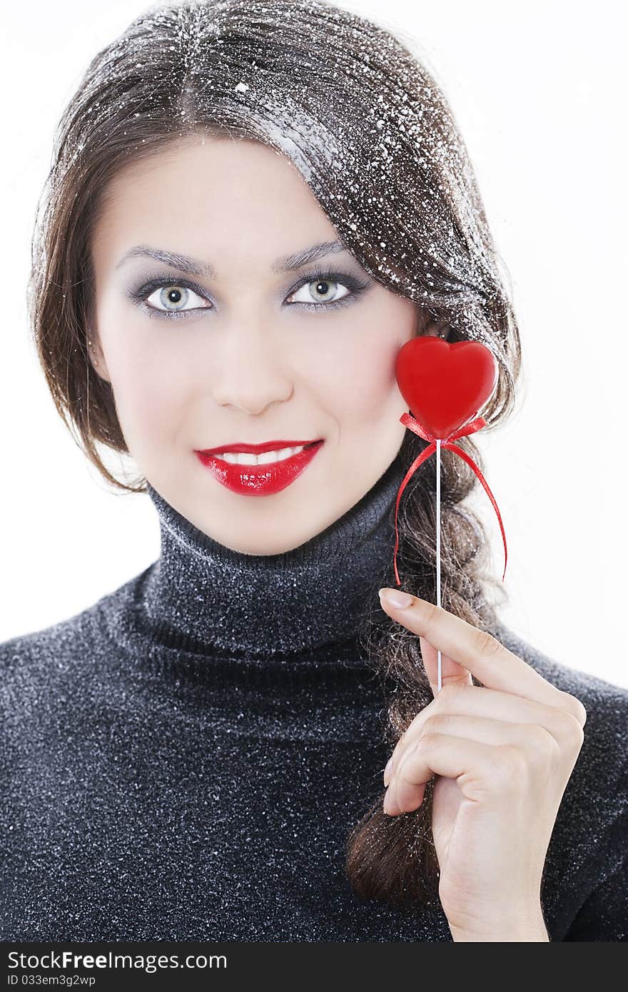 Beautiful smiling woman with heart on white background