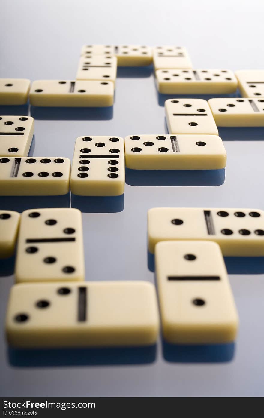 Close-up of domino on blue background