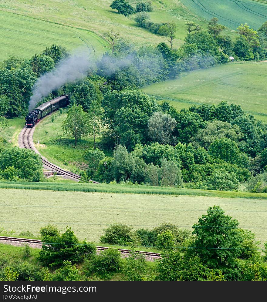 Steaming engine in green delicious scenery in the Black Forest. Steaming engine in green delicious scenery in the Black Forest