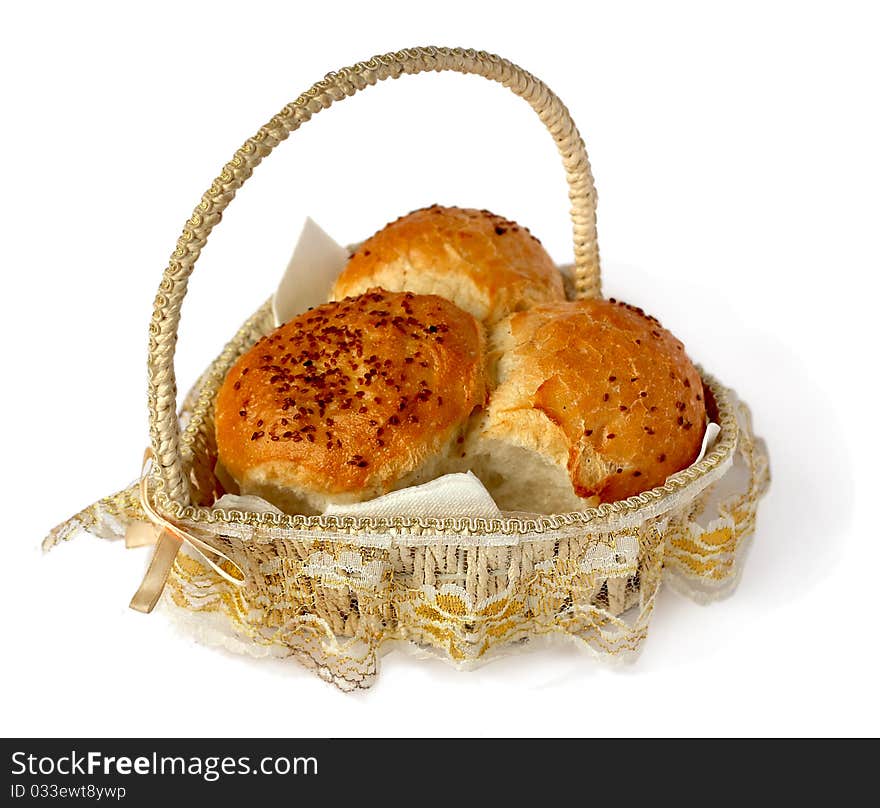 Bread in a wicker basket on a white background