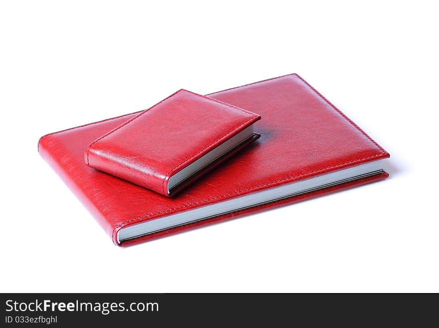 Two red books isolated over a white background.