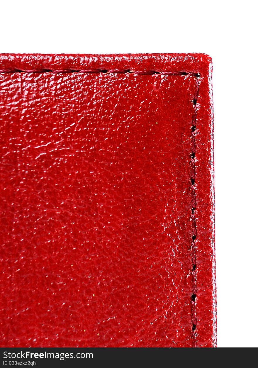 Red leather with stitch on a white background