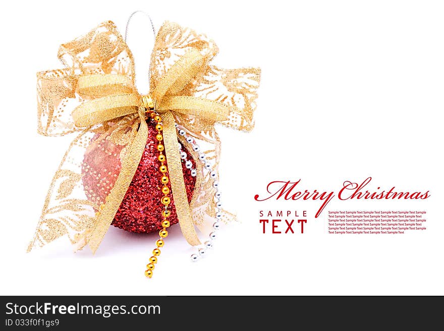 Red christmas balls and gold bow ribbon on white background with copy space