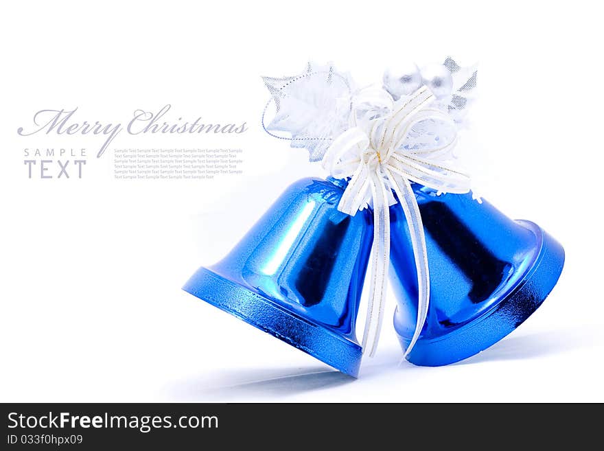 Blue christmas bell and silver bow ribon on white background with copy space. Blue christmas bell and silver bow ribon on white background with copy space