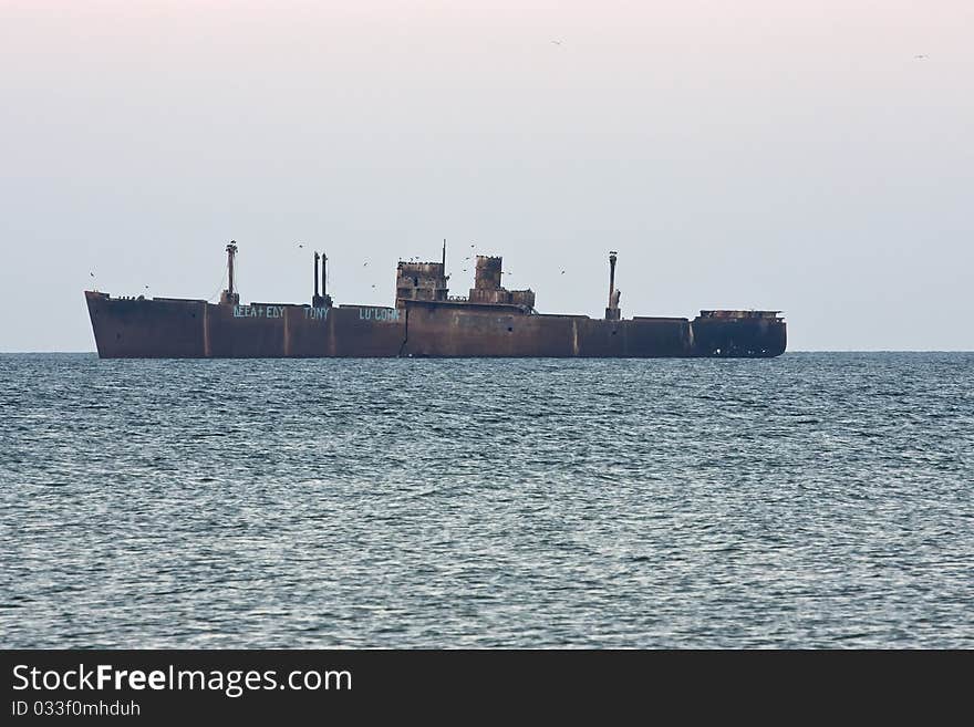 Ship wreck in the Black Sea at Costinesti, Romania. Touristic attraction of the small town.