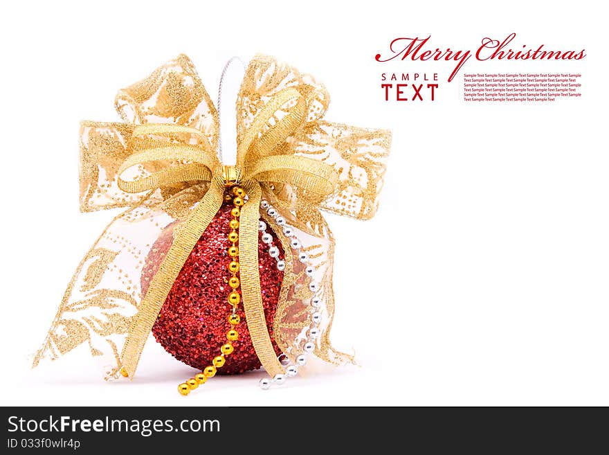 Red christmas balls and gold bow ribbon on white background with copy space