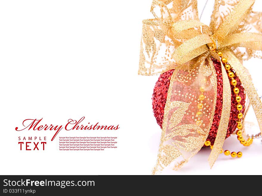 Red christmas balls and gold bow ribbon on white background with copy space