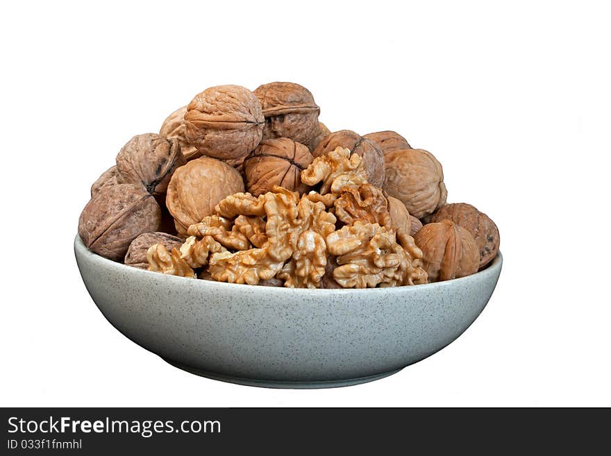 Walnut in ceramic  bowl in isolated over white