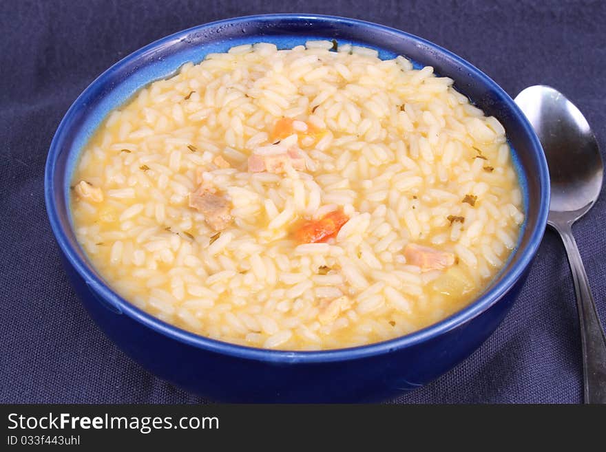 Bowl of rice with chicken and carrots