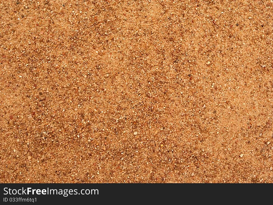 Texture of orange larde sand grains. Texture of orange larde sand grains