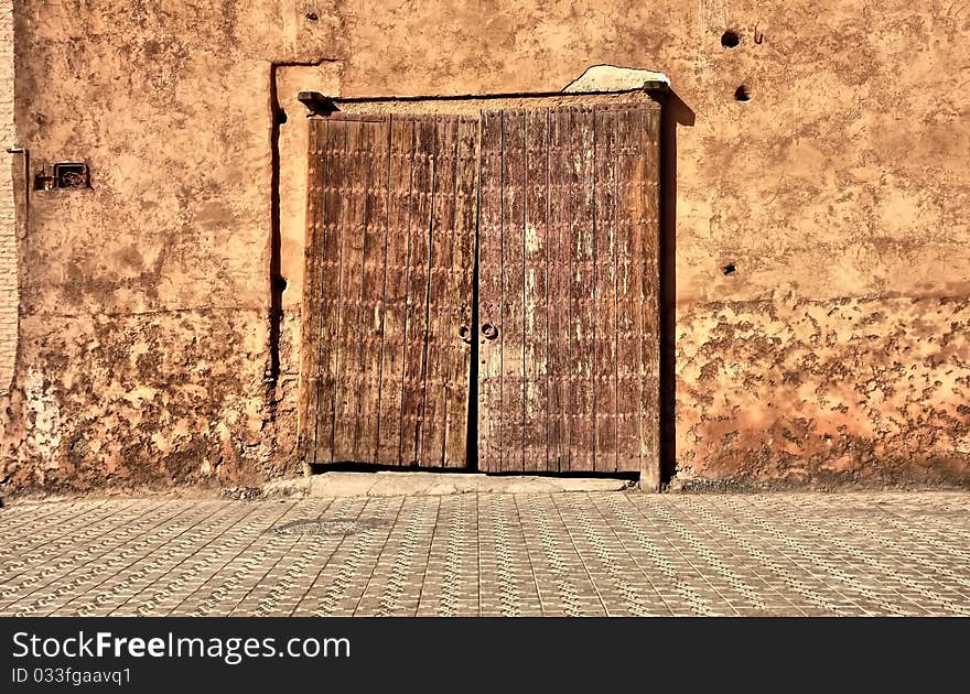 Very old wood door in sand wall. Very old wood door in sand wall