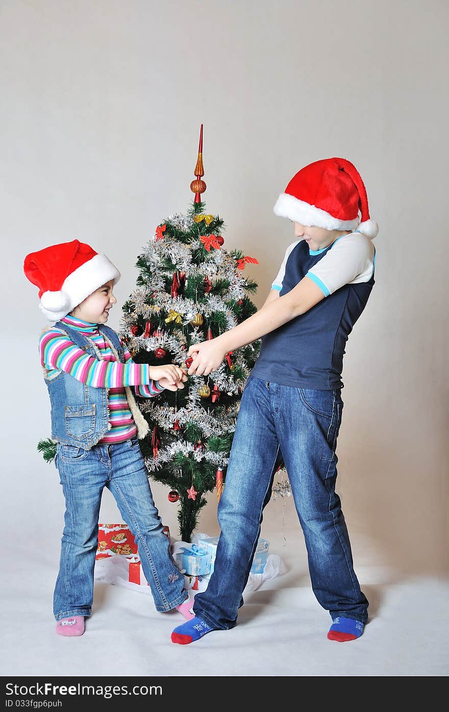 Kids fight because of decoration on Christmas tree. Kids fight because of decoration on Christmas tree