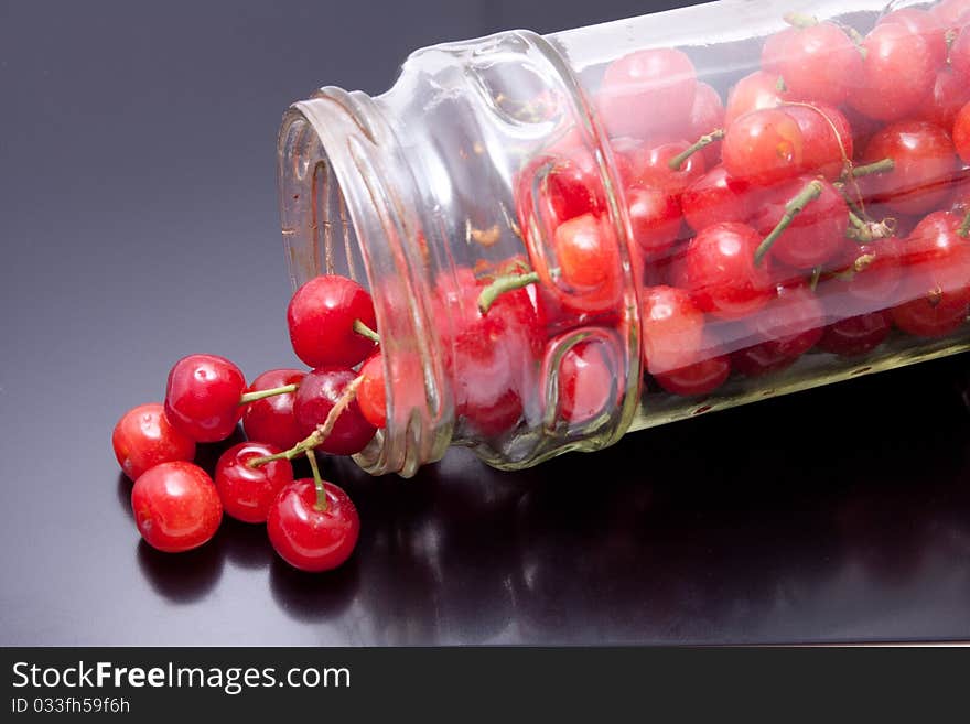 Fresh picked cherries still attached to their stem. Fresh picked cherries still attached to their stem