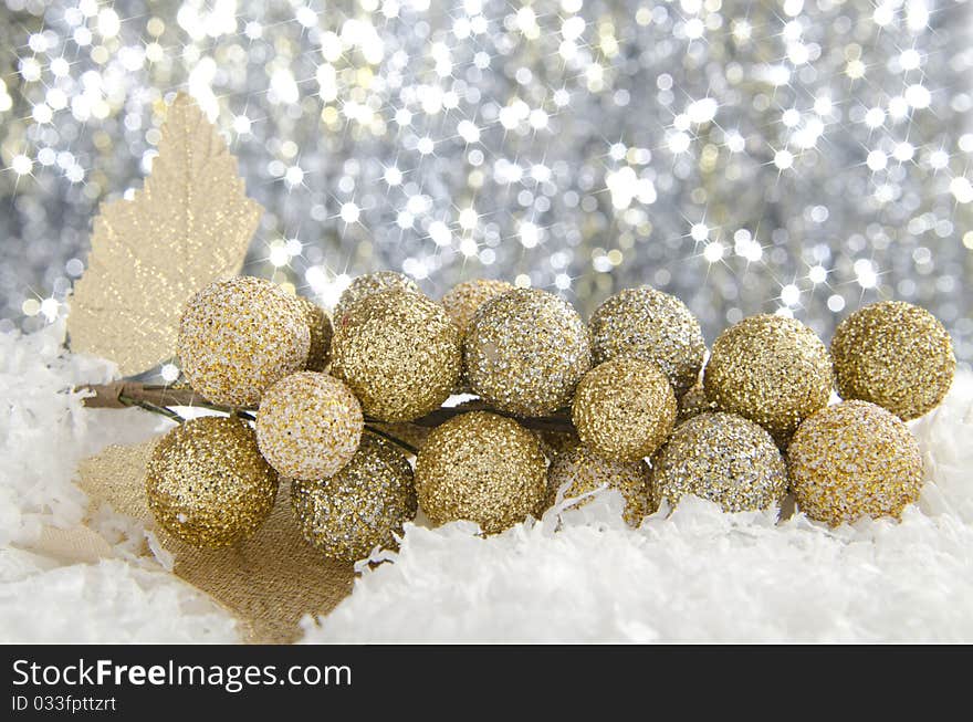 Golden Christmas decorations against a sparkling background