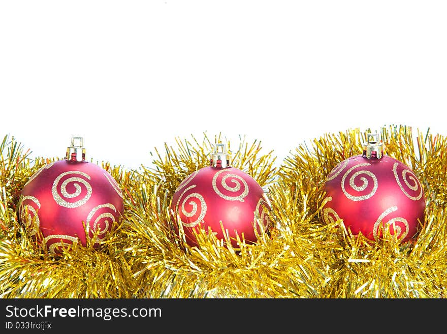 Three red christmas ball and gold decoration, isolated