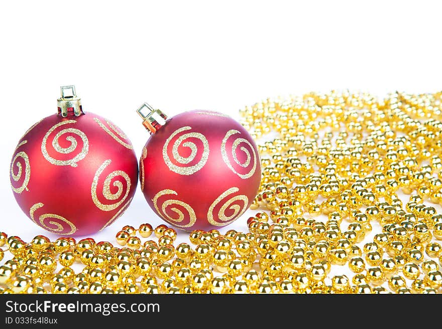 Two red christmas ball and gold decoration, isolat